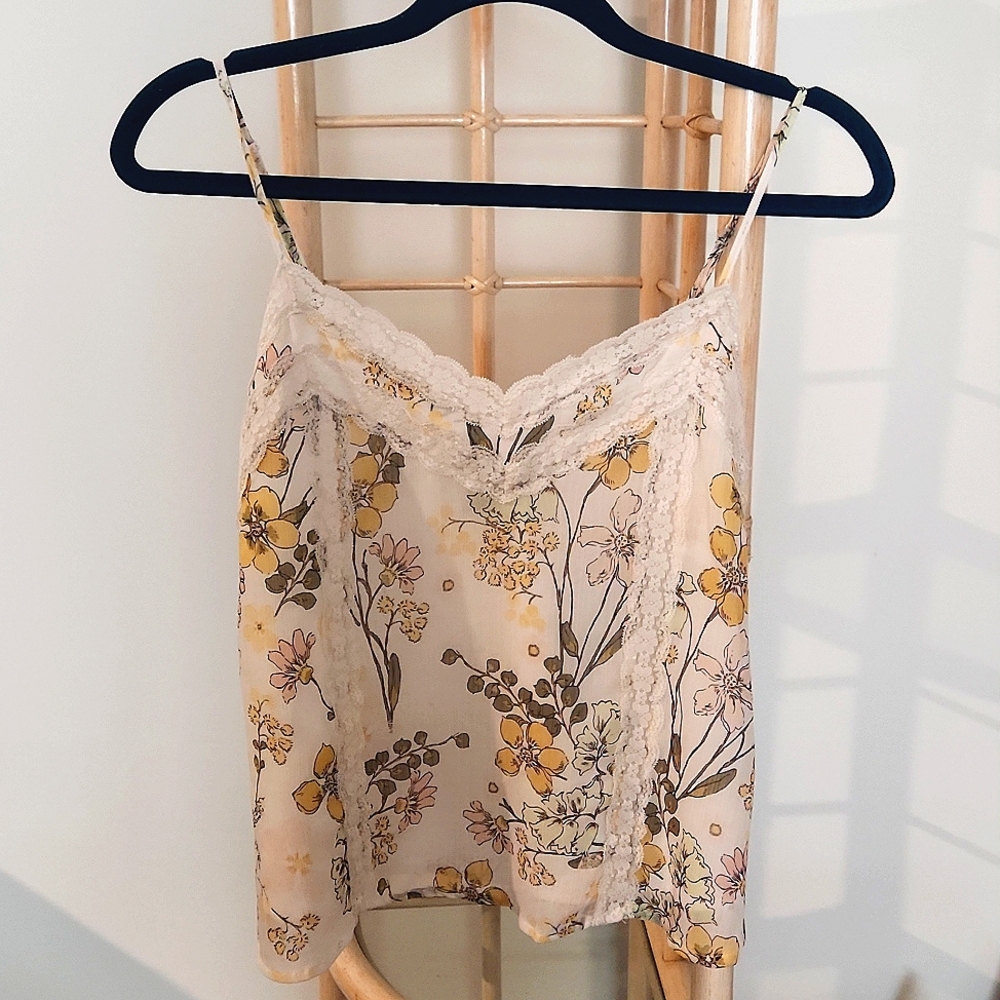 Beautiful, lined lace trimmed tank top. Size small.